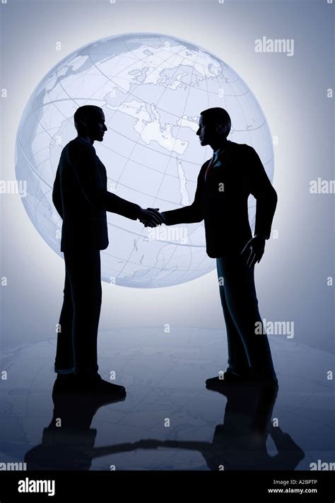 Businessmen Shaking Hands Globe Hi Res Stock Photography And Images Alamy