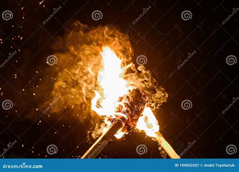 Two Burning Torches On A Dark Background Smoke And Fire From Burning