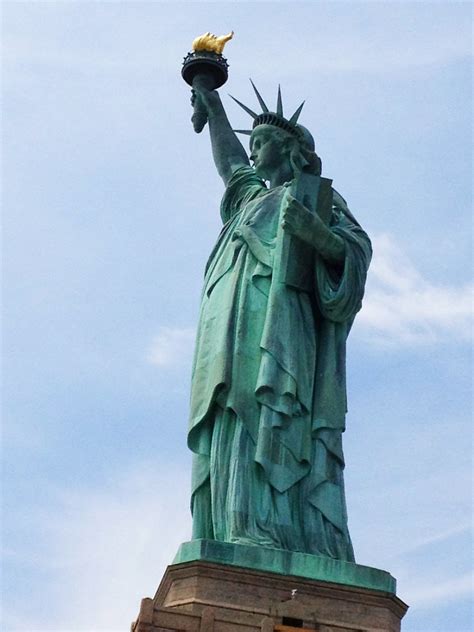 The statue of liberty enlightening the world was a gift of friendship from the people of france to the people of the united states and is a universal symbol of freedom and democracy. Grand photos of the colossal Statue of Liberty in New York ...