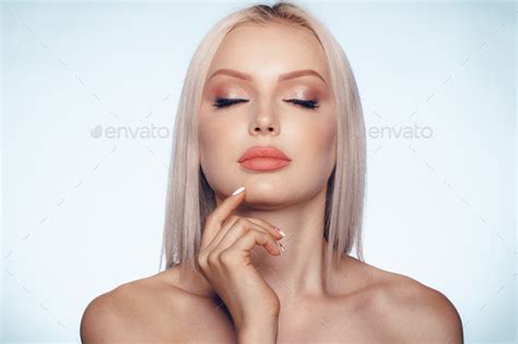 Close Up Beauty Portrait Of A Blonde Woman With Perfect Skin And Plump