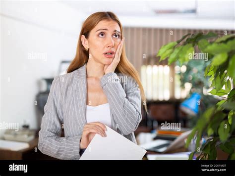 Sad Female Secretary With Clipboard In Hands Stock Photo Alamy
