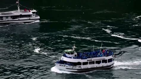 Canada Us Tourist Boats At Niagara Falls Highlight Difference In