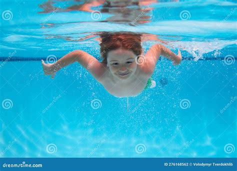 Kid Boy Swimming Underwater On The Beach On Sea In Summer Blue Ocean