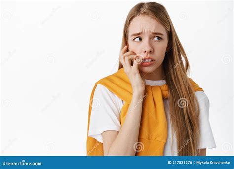 Scared Timid Girl Looking Frightened And Anxious Biting Fingers And