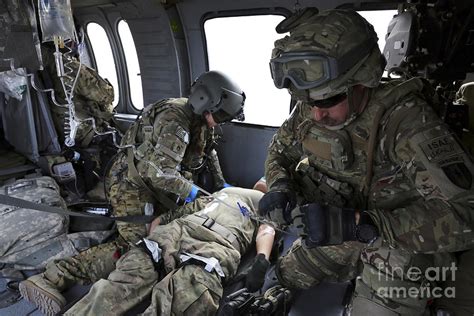 Us Army Flight Medics Aid A Simulated Photograph By Stocktrek Images