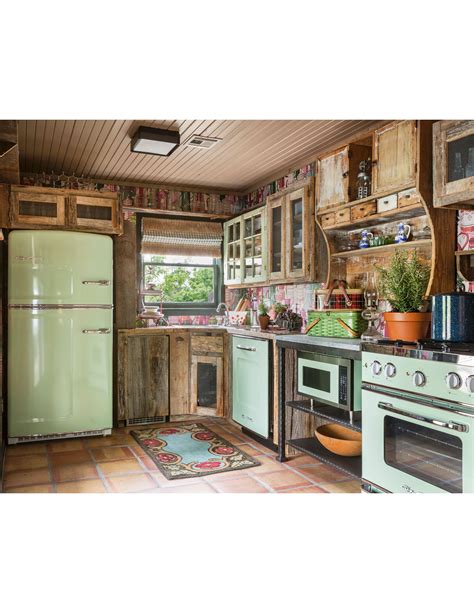 Guest Cottage Kitchen Assembled With Mismatched Antique Cabinets And