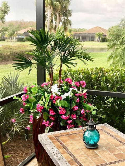 This artificial flower arrangement looks like a freshly picked bunch of roadside wildflowers. Outdoor artificial plants can brighten any pool lanai ...