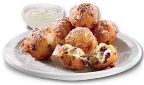 Denny's has bite size blueberry pancake 'puppies' with a side of cream cheese icing. FREE Blueberry Pancake Puppies Sundae at Denny's - I Crave Freebies