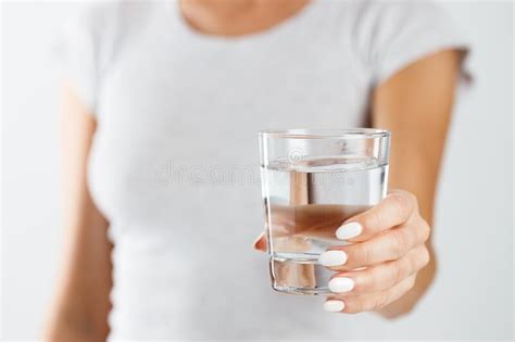 A Woman Holds A Glass Of Water In Her Hands Healthy Lifestyle Concept