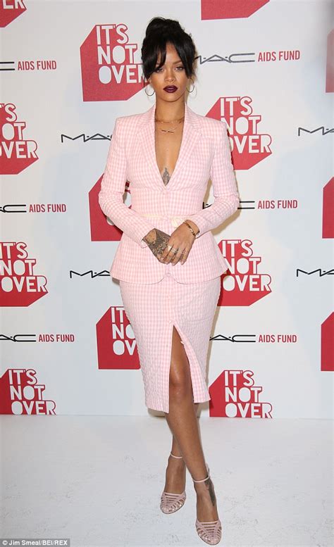rihanna takes the plunge and goes shirtless underneath a conservative pink checked suit daily