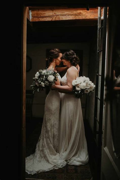 Two Brides Standing Together In An Open Doorway