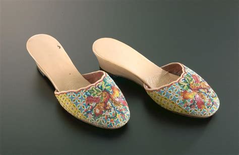 a pair of beaded slippers