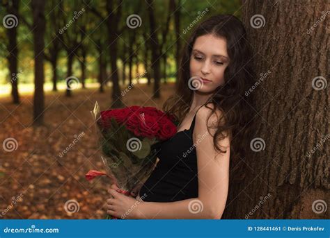 Brunette Girl With A Bouquet Of Red Roses Stock Image Image Of