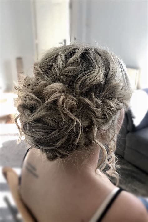 The hair at the crown is turned into a bun like structure. Textured Bridal Updo by MUBYLEIGH. | Bridal updo, Bridal hair, Wedding hairstyles