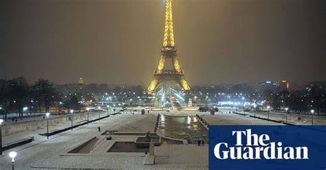 Paris In The Snow In Pictures World News The Guardian