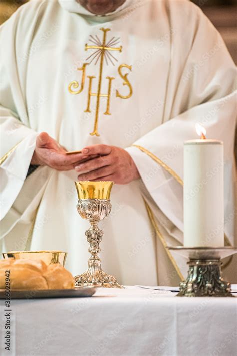 Priest Giving Eucharist Stock Photo Adobe Stock