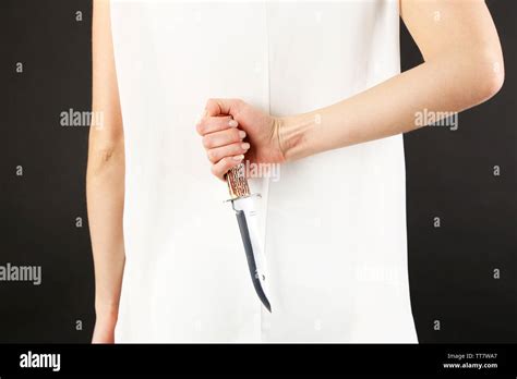 Woman Holding Knife Behind Back Hi Res Stock Photography And Images Alamy