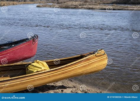 Bow Of Beautiful Home Built Wooden Canoe On A River Shore Stock Photo