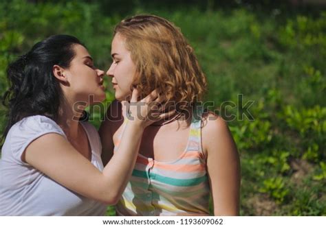 Two Girls Show Passion Brunette Girl Stock Photo 1193609062 Shutterstock