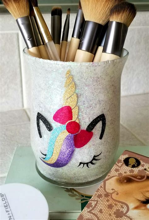 Homemade brush holder constructed from a surplus plastic soda bottle and a zip tie. Cute Makeup Brush Holders DIY with Glitter! - Leap of ...