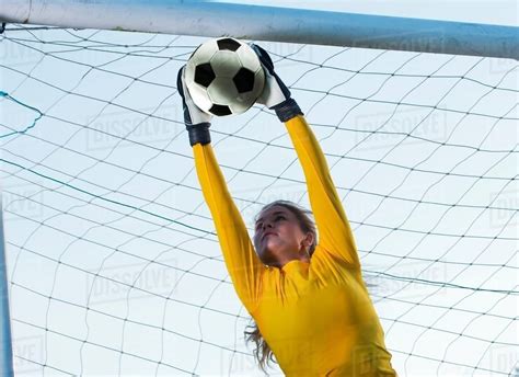 Soccer Player Catching Ball In Goal Stock Photo Dissolve