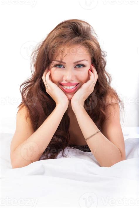 Portrait Of Beautiful Young Woman Lying In Bed 945337 Stock Photo At