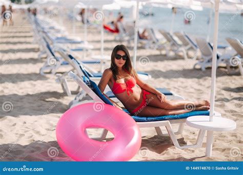Woman On The Chaise Lounge On The Beach Beautiful Woman In Pink Swimsuit Stock Photo Image Of