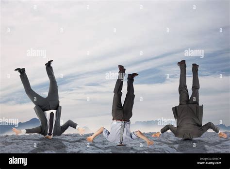 Composite Image Of Businessmen Burying Their Heads Stock Photo Alamy