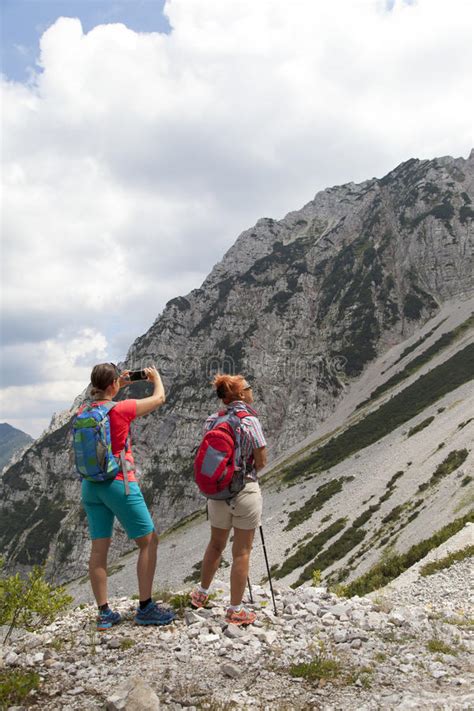 Two Pretty Female Women Photographing A Selfie On Mountain