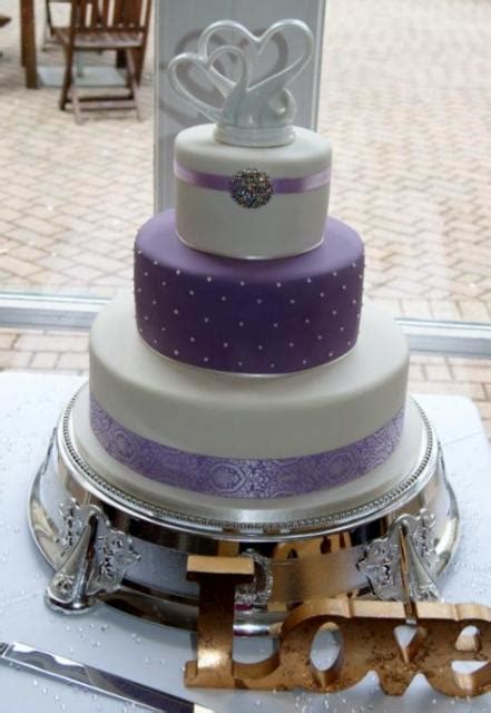 Ombre blue and purple wedding cake. 3 tier ivory and lavender wedding cake with heart shape ...