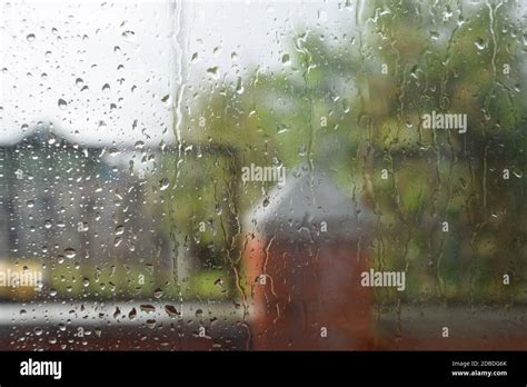 Raindrops On The Window Pane Blurred Background Outside The Window In