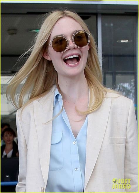 Elle Fanning Makes Chic French Arrival Ahead Of Cannes Film Festival