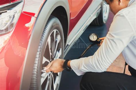 Find & download the most popular car inspection photos on freepik free for commercial use high quality images over 8 million stock photos. Man With Car Inspection Measure Quantity Inflated Rubber ...
