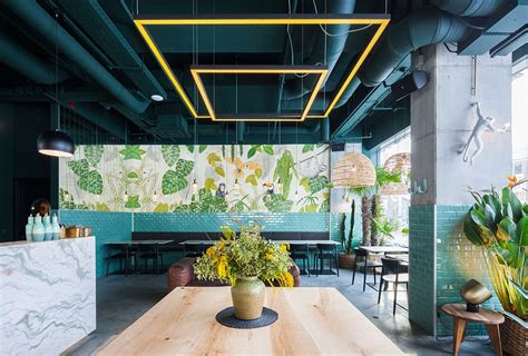 Industrial Style Restaurant With A Greenery Themed Decor