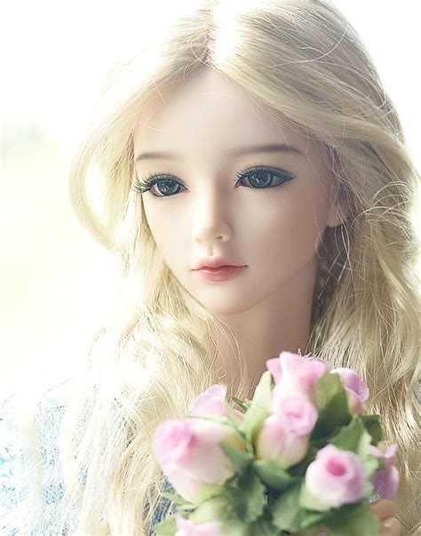A Barbie Doll Holding A Bouquet Of Flowers