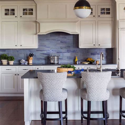 If it's a dark kitchen, prefer white white cabinets with black countertops, a blue kitchen island with a white countertop and a wooden part seem very contrasting. Black wood countertop modern blue glass backsplash tile ...