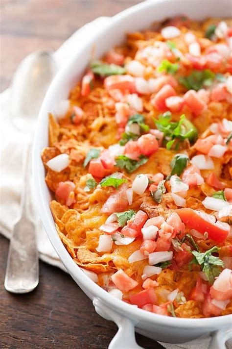 In a large bowl mix together shredded chicken, 1 cup of cheese, cream of chicken soup, milk, sour cream, rotel tomatoes, and taco seasoning. Dorito Casserole - a cheesy casserole the family goes ...