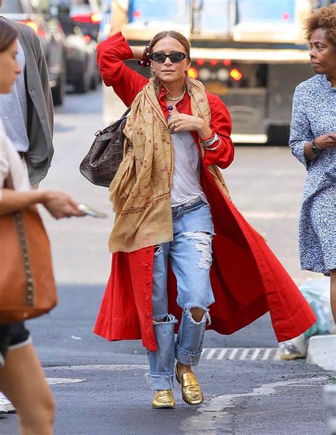 Mary Kate Olsen Wears A Summer Ready Trench Coat In A Bright Red Hue
