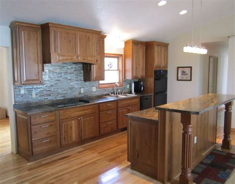 Finished in dark cinnamon cherry and detailed with frame and panel doors and sides, this tall cabinet is perfect for the kitchen. Karman brand Rustic Cherry cabinets, "Harvest" doorstyle ...