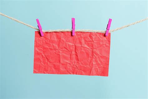 Rectangle Shaped Note Colored Paper Clipped In A Clothesline By