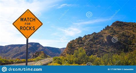 Falling Rock Sign Next To The Road Stock Photo Image Of