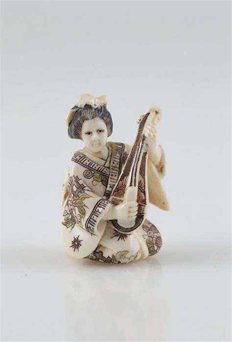 signed carved ivory netsuke of a geisha stained patterned… netsuke oriental