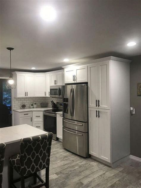 The white cabinets contrast with black countertops, and they would look off if it weren't of the mid tones. Wow - brilliant Small Kitchen Renovation | White shaker ...
