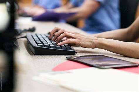 Clinic Female Nurse Typing At Keyboard By Stocksy Contributor Sean Locke Stocksy