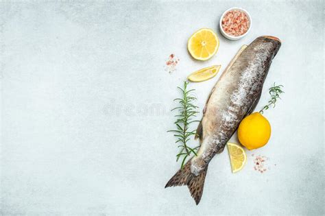 Raw Fish Salmon With Lemons And Ingredients For Cooking Raw Fish Trout