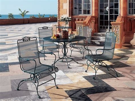 Vintage french wrought iron patio set with 2 lounge chairs, 3 seat sofa and cushions. 40 wrought iron patio furniture sets for a stylish outdoor area