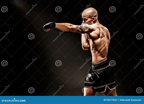 Muscular Kickbox Or Muay Thai Fighter Punching Stock Photo Image Of