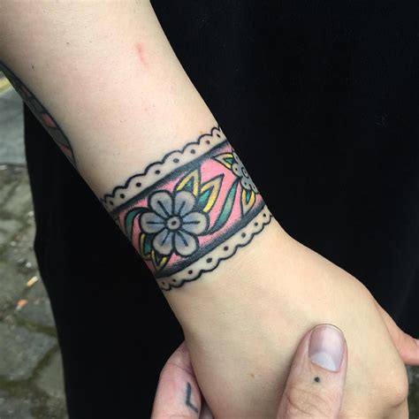 Floral Wristband Tattoo On The Wrist With Images Wrist Tattoos
