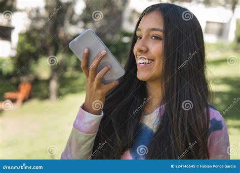 Latin Teenage Girl Sending A Voice Message With Her Cell Phone Stock Image Image Of Black