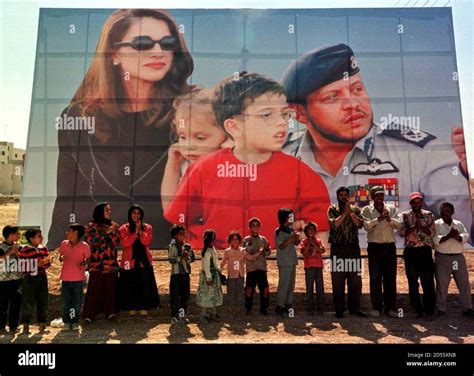 Jordanians Celebrate In Front Of A Huge Poster Of King Abdullah And His